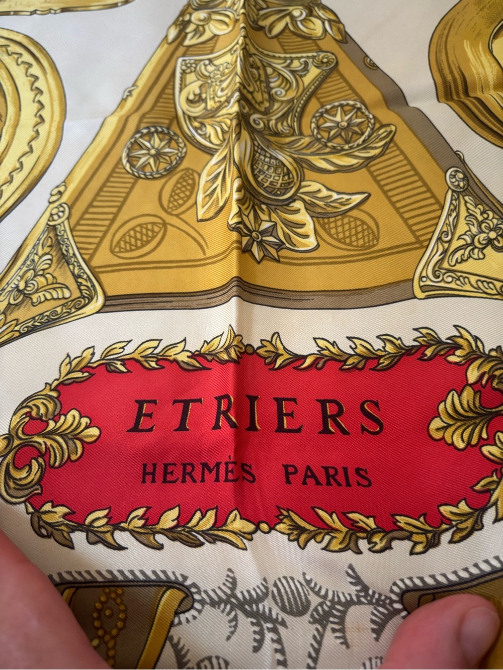Hermès silk scarf in gold, red and black ornate print